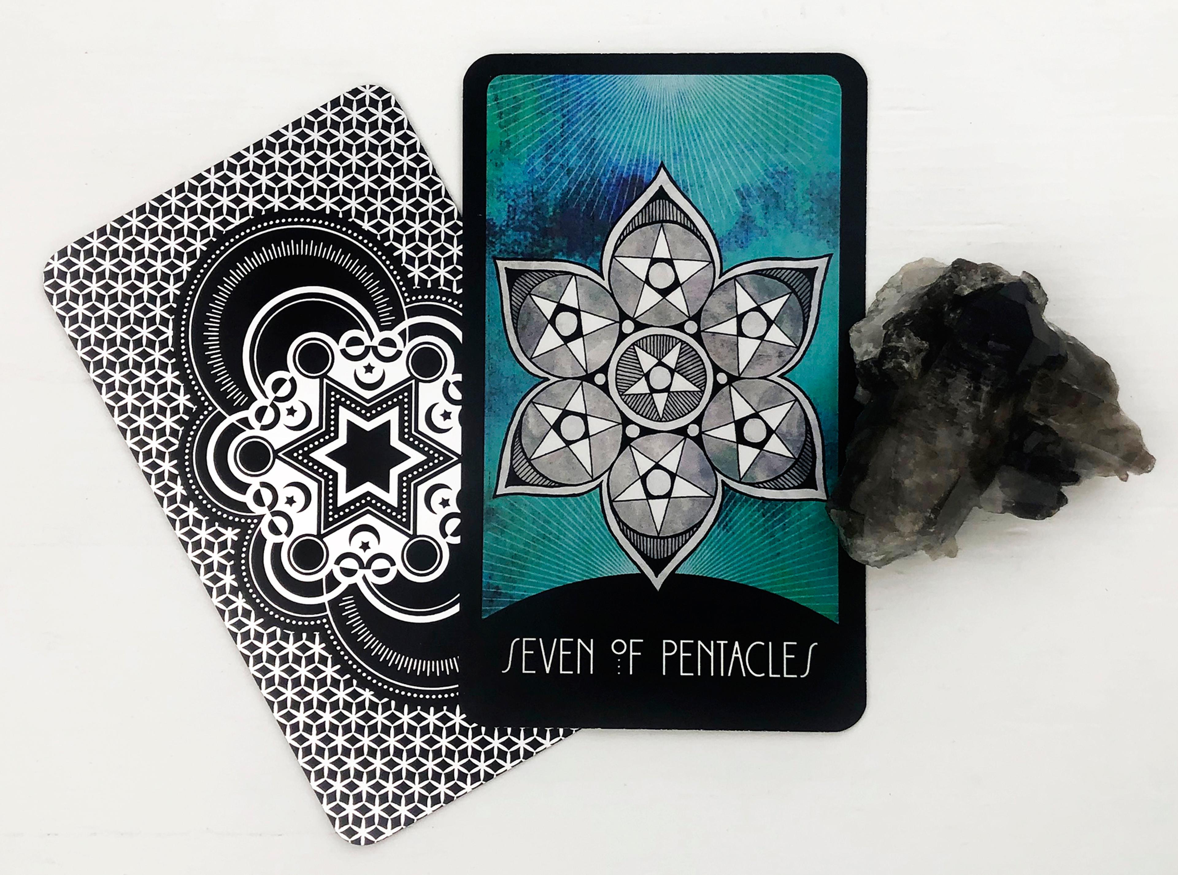 The Seven of Pentacles Tarot Card